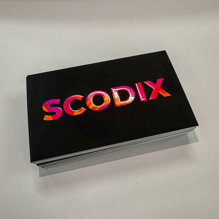 Black business cards with a raised clear finish similar to spot UV